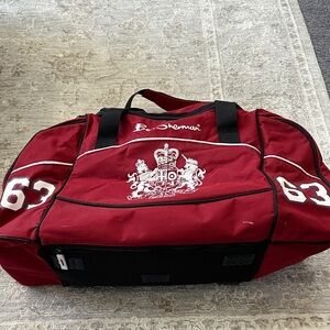 Ben Sherman Burgundy Duffel Bag with Black Accents.